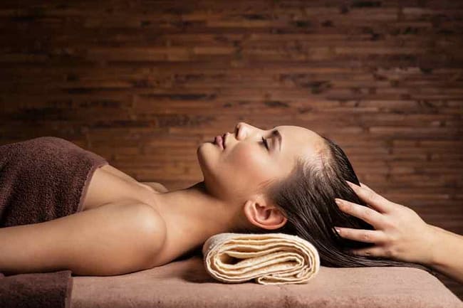 Woman getting a scalp massage